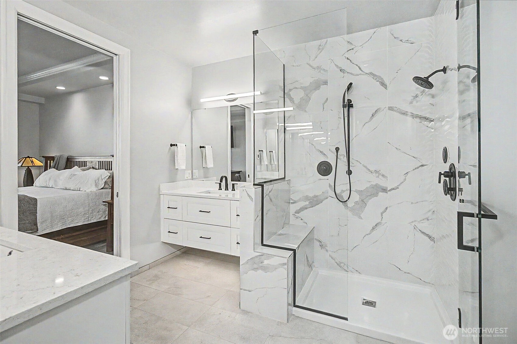 4907 Main Street, Unit 608 Tacoma, WA 98407 - Photo 25 of 40 a bathroom with a shower sink and mirror