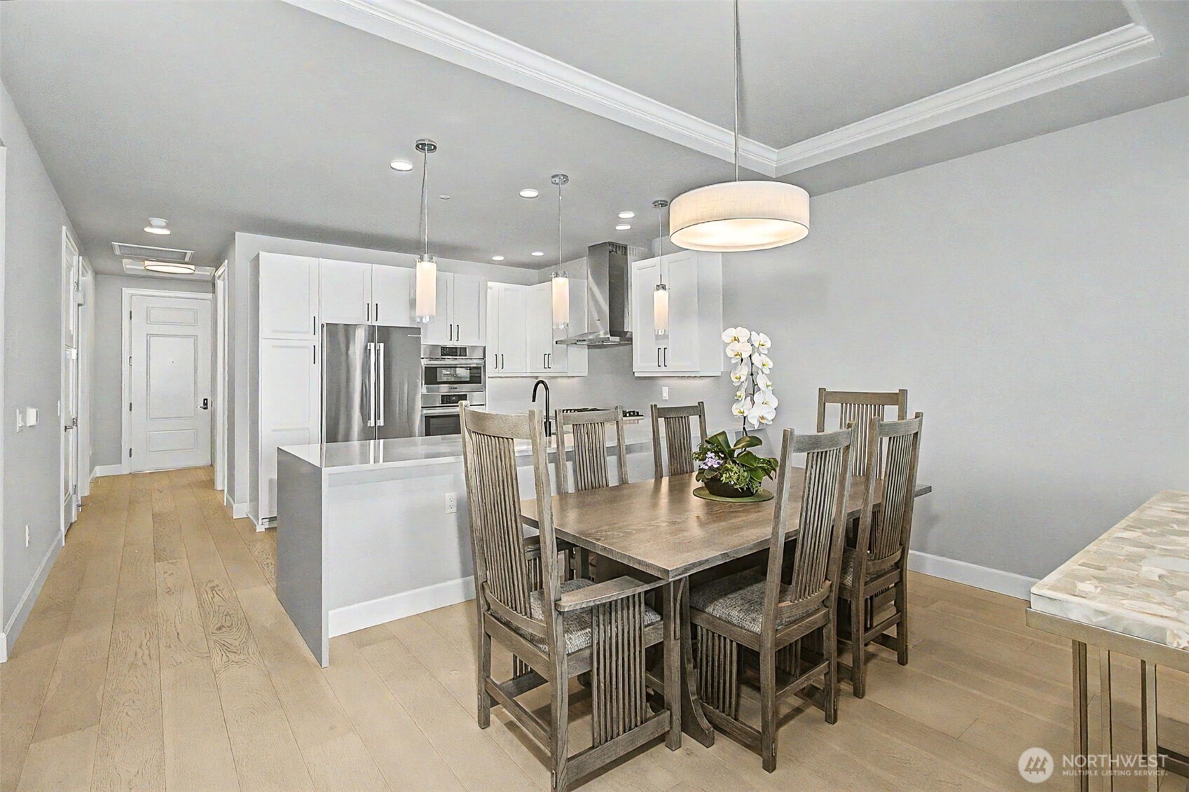 4907 Main Street, Unit 608 Tacoma, WA 98407 - Photo 4 of 40 a dining room with furniture and chandelier
