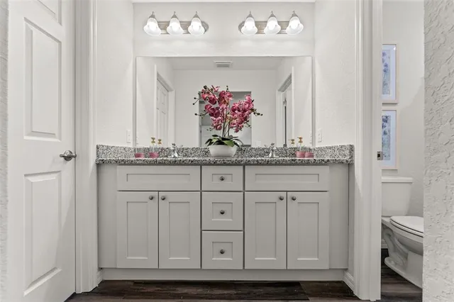a bathroom with cabinets and a sink