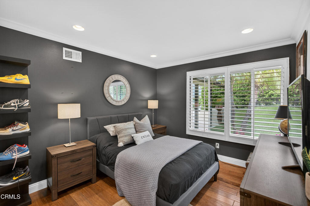 9325 La Shell Drive Tujunga, CA 91042 - Photo 22 of 46 a bedroom with a bed and a large window