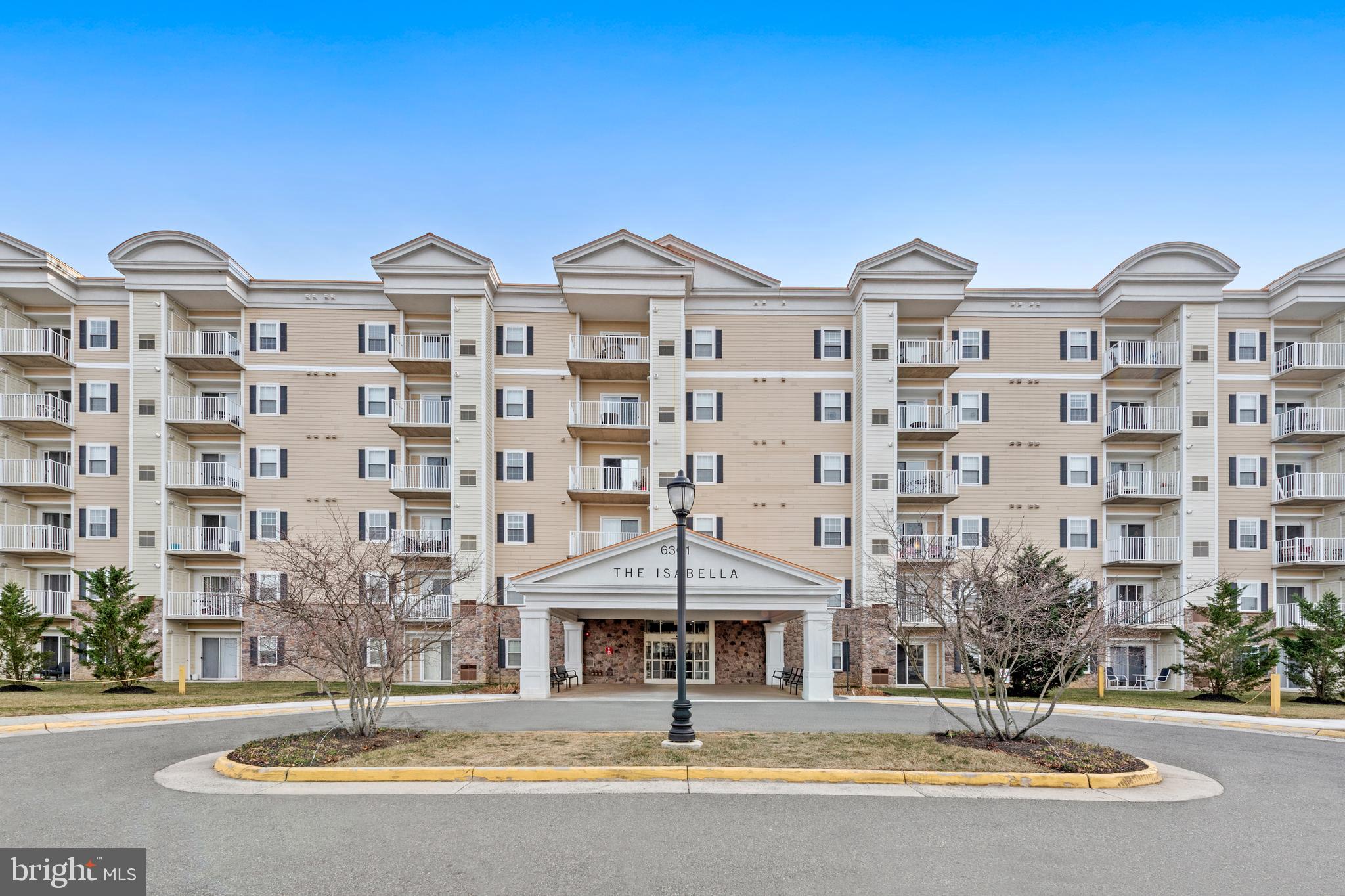 6301 Edsall Road, Unit 424 Alexandria, VA 22312 - Photo 2 of 30 a front view of a building with a garden and plants