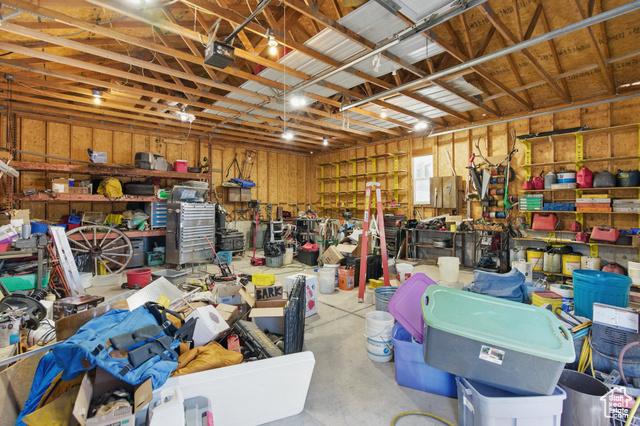 151 South Haulage Road Eureka, UT 84628 - Photo 35 of 36 Garage with a workshop area and a garage door opener
