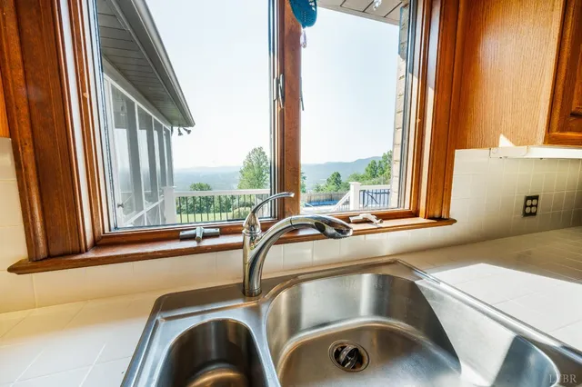 a bathroom with a toilet a sink and shower