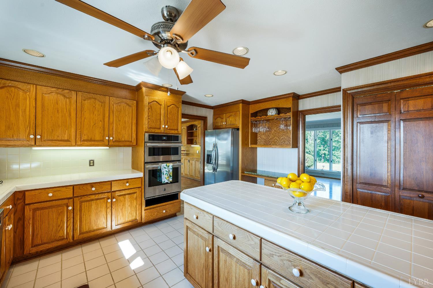 355 Dyson Road Amherst, VA 24521 - Photo 19 of 96 a kitchen with a stove a refrigerator and a sink