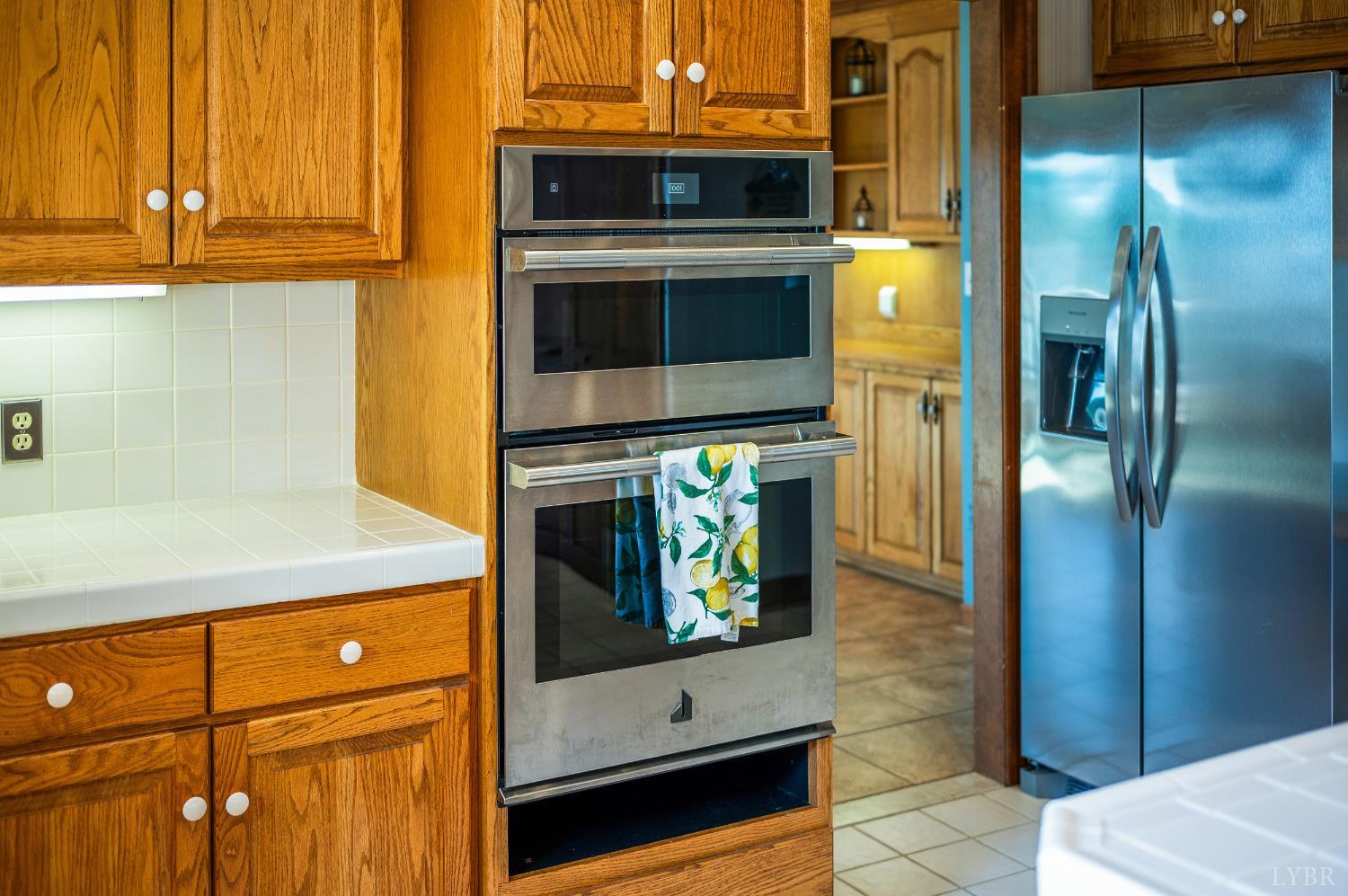 355 Dyson Road Amherst, VA 24521 - Photo 20 of 96 a kitchen with stainless steel appliances granite countertop a refrigerator and a stove