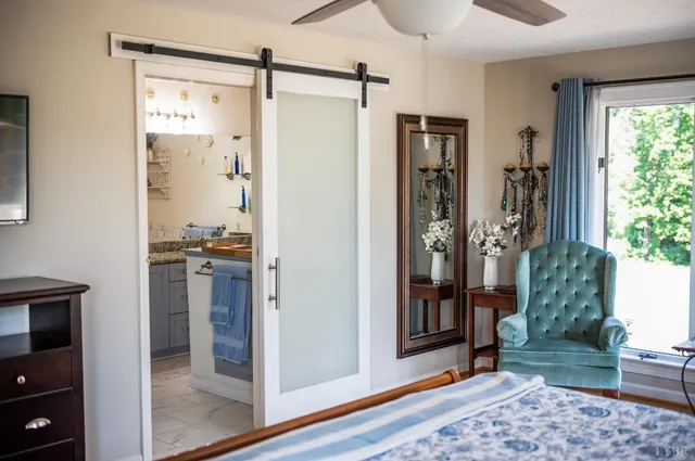 a bathroom with a double vanity sink mirror and shower