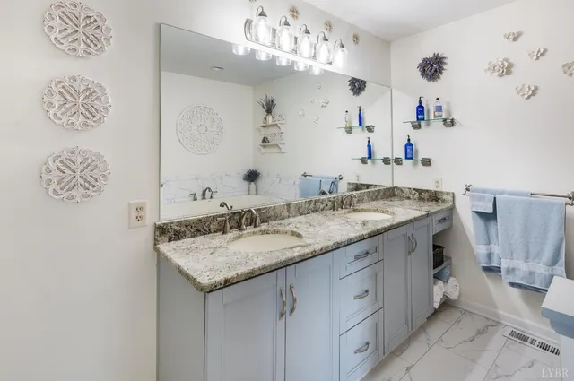 a view of a room with wooden floors and a window