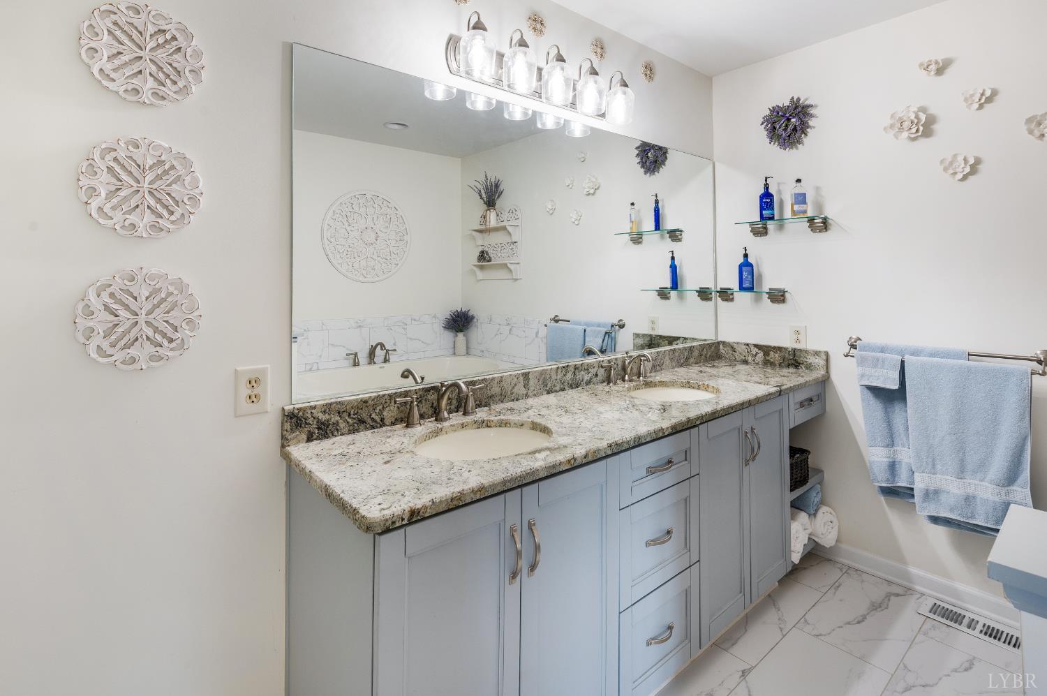 355 Dyson Road Amherst, VA 24521 - Photo 30 of 96 a bathroom with a granite countertop sink and a mirror
