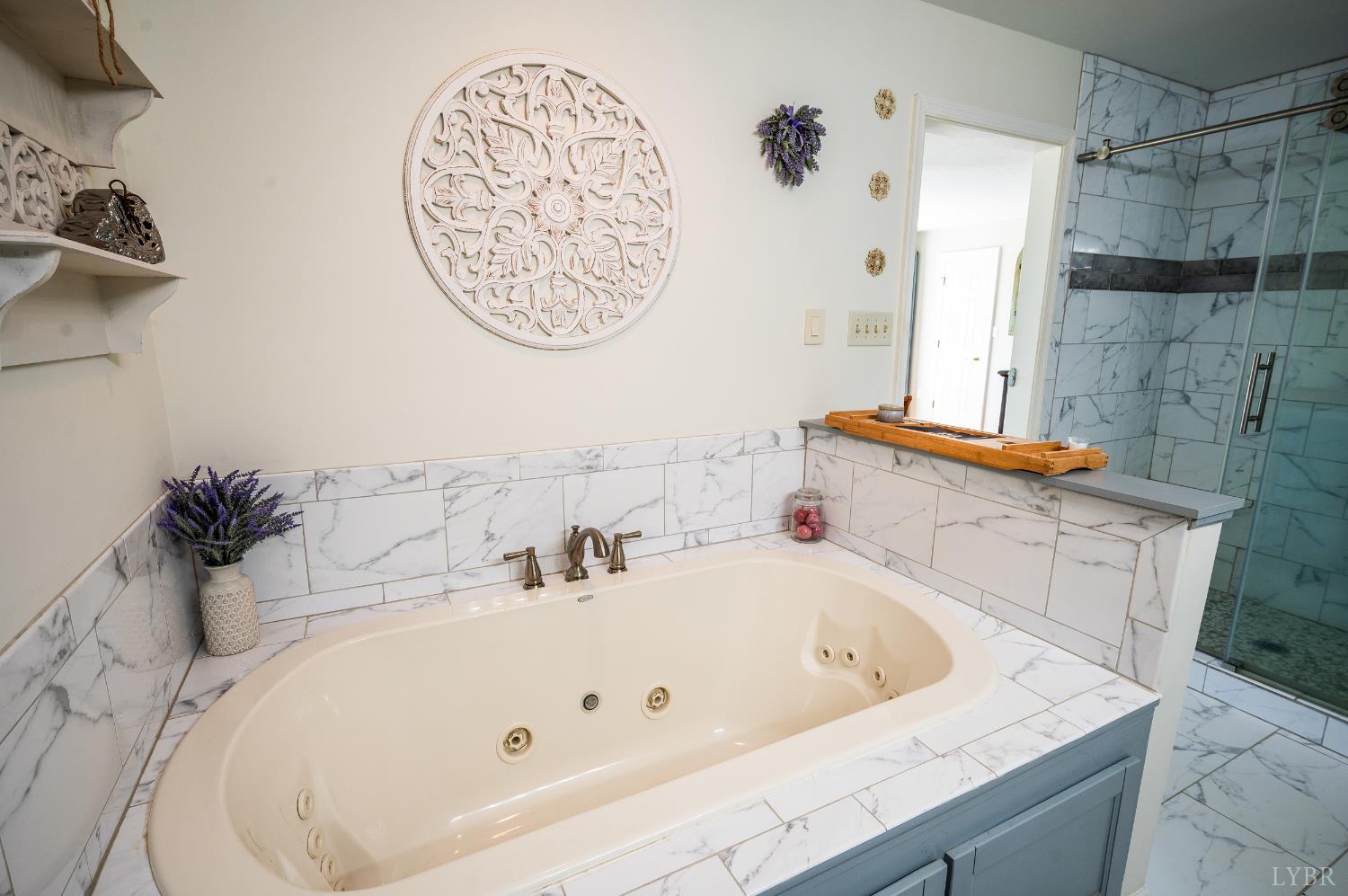 355 Dyson Road Amherst, VA 24521 - Photo 34 of 96 a bathroom with a tub sink and mirror