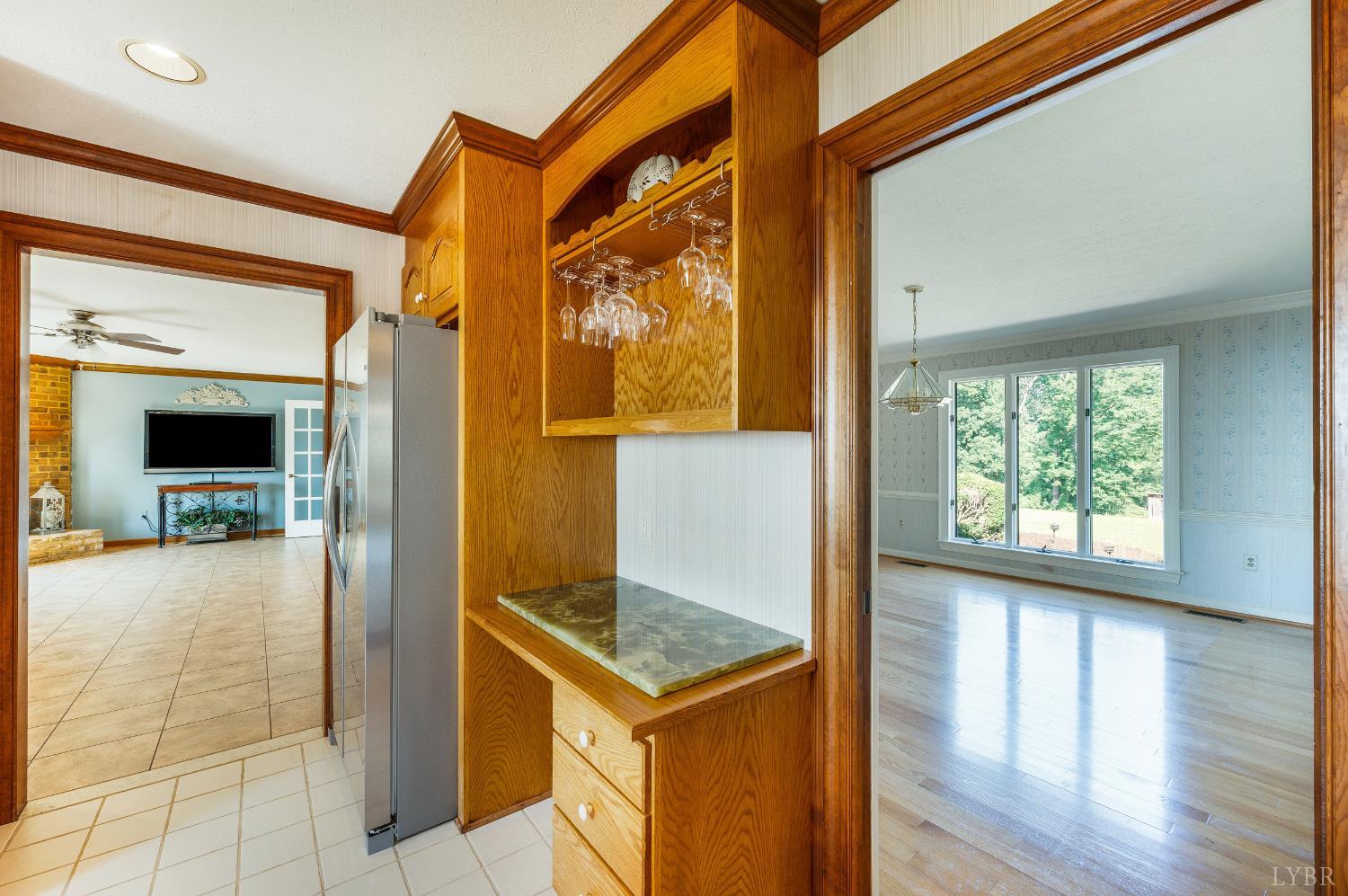 355 Dyson Road Amherst, VA 24521 - Photo 36 of 96 a view of a hallway with wooden floor and a living room