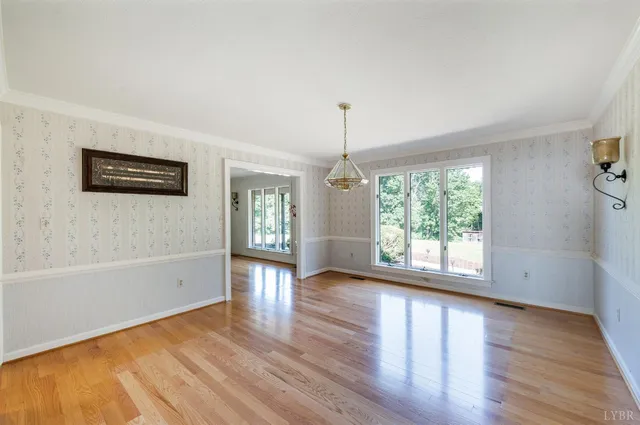 a view of a lush green hillside and a building