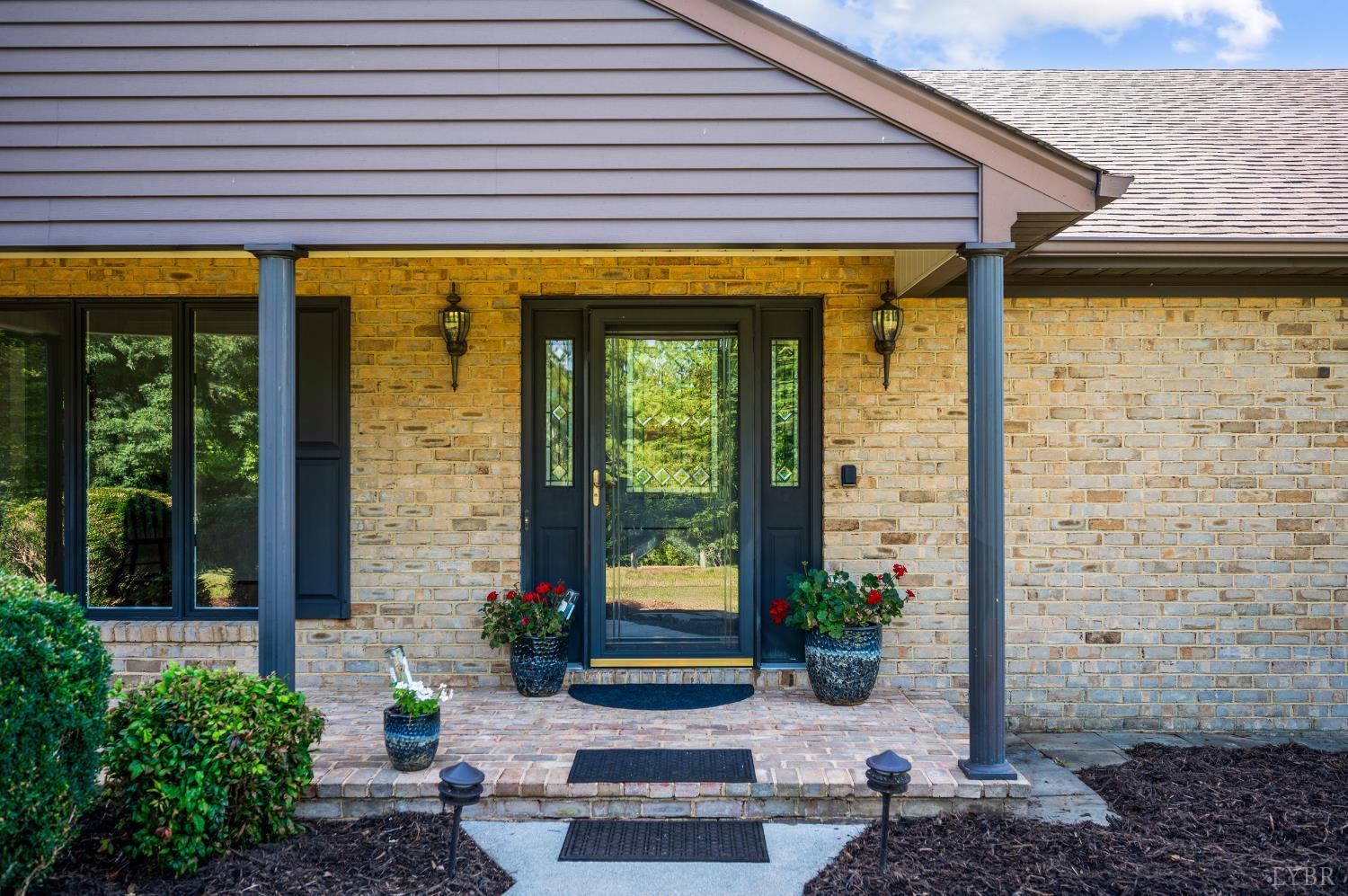 355 Dyson Road Amherst, VA 24521 - Photo 4 of 96 a front view of a house with a porch