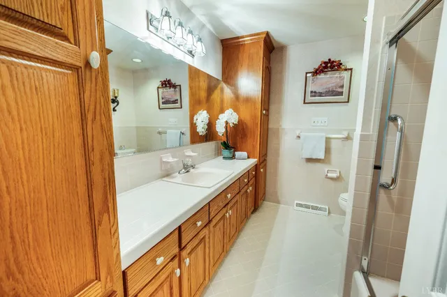 a view of a porch with furniture and a backyard