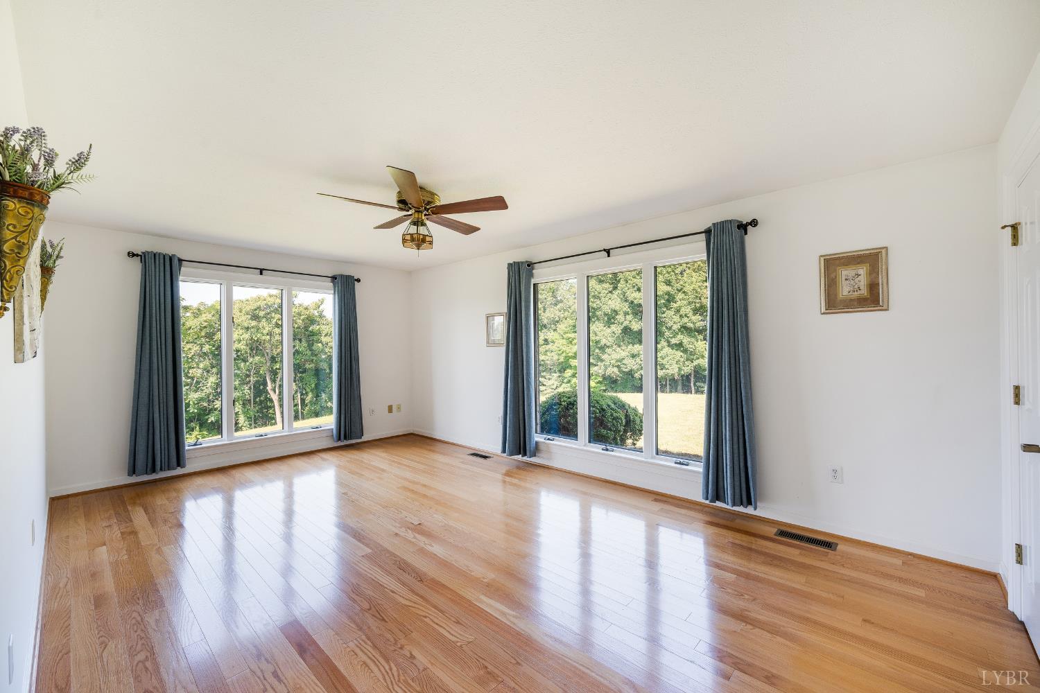 355 Dyson Road Amherst, VA 24521 - Photo 49 of 96 a view of a room with wooden floors and a window