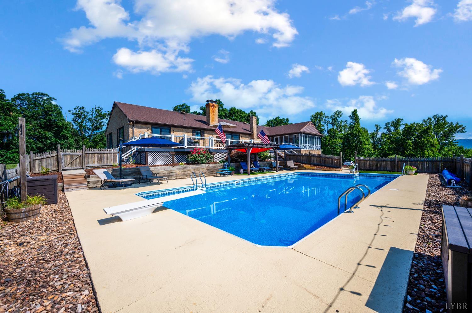 355 Dyson Road Amherst, VA 24521 - Photo 70 of 96 a view of a swimming pool with a patio and a yard