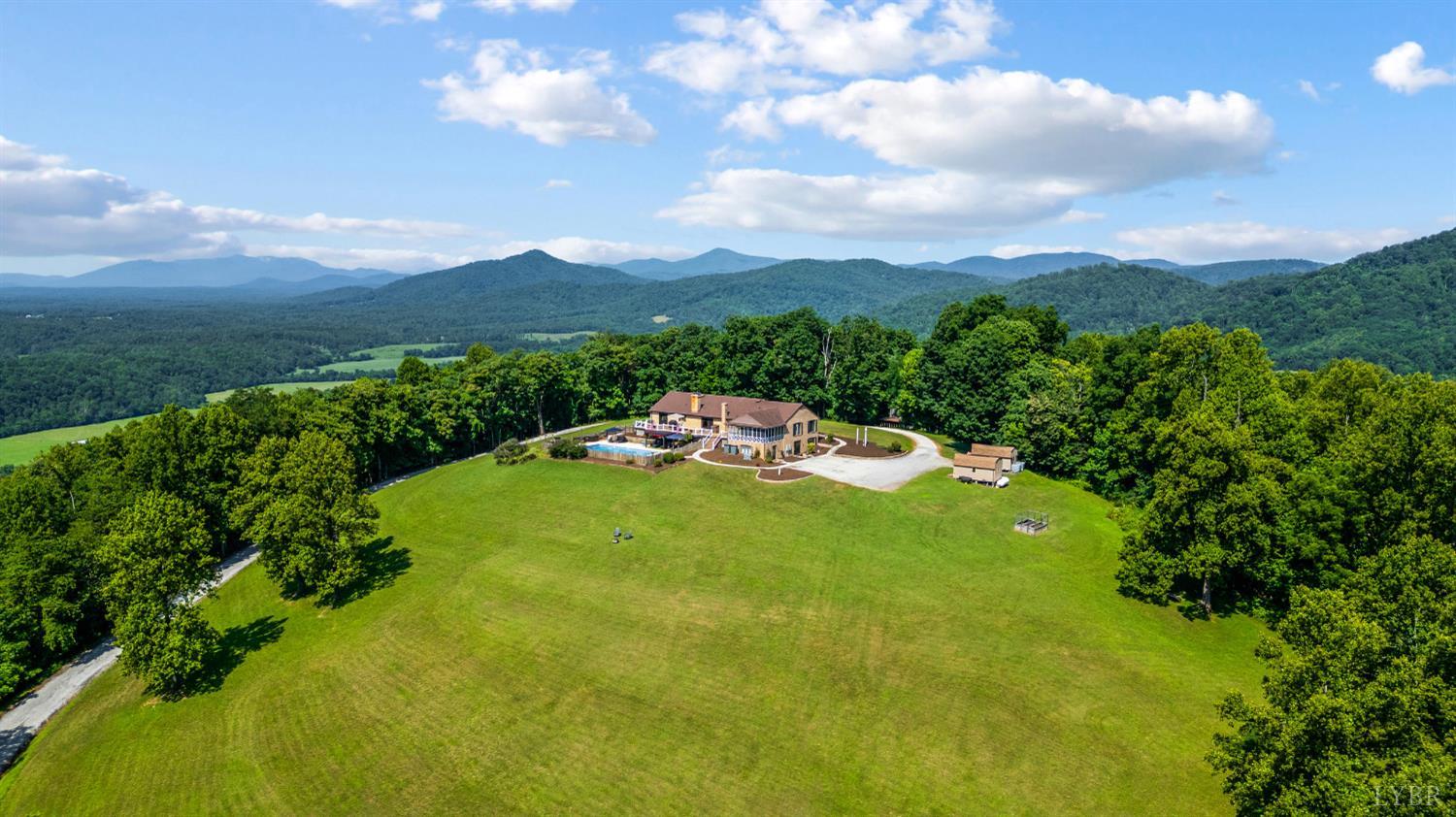 355 Dyson Road Amherst, VA 24521 - Photo 86 of 96 a backyard of a house with lots of green space and mountain view