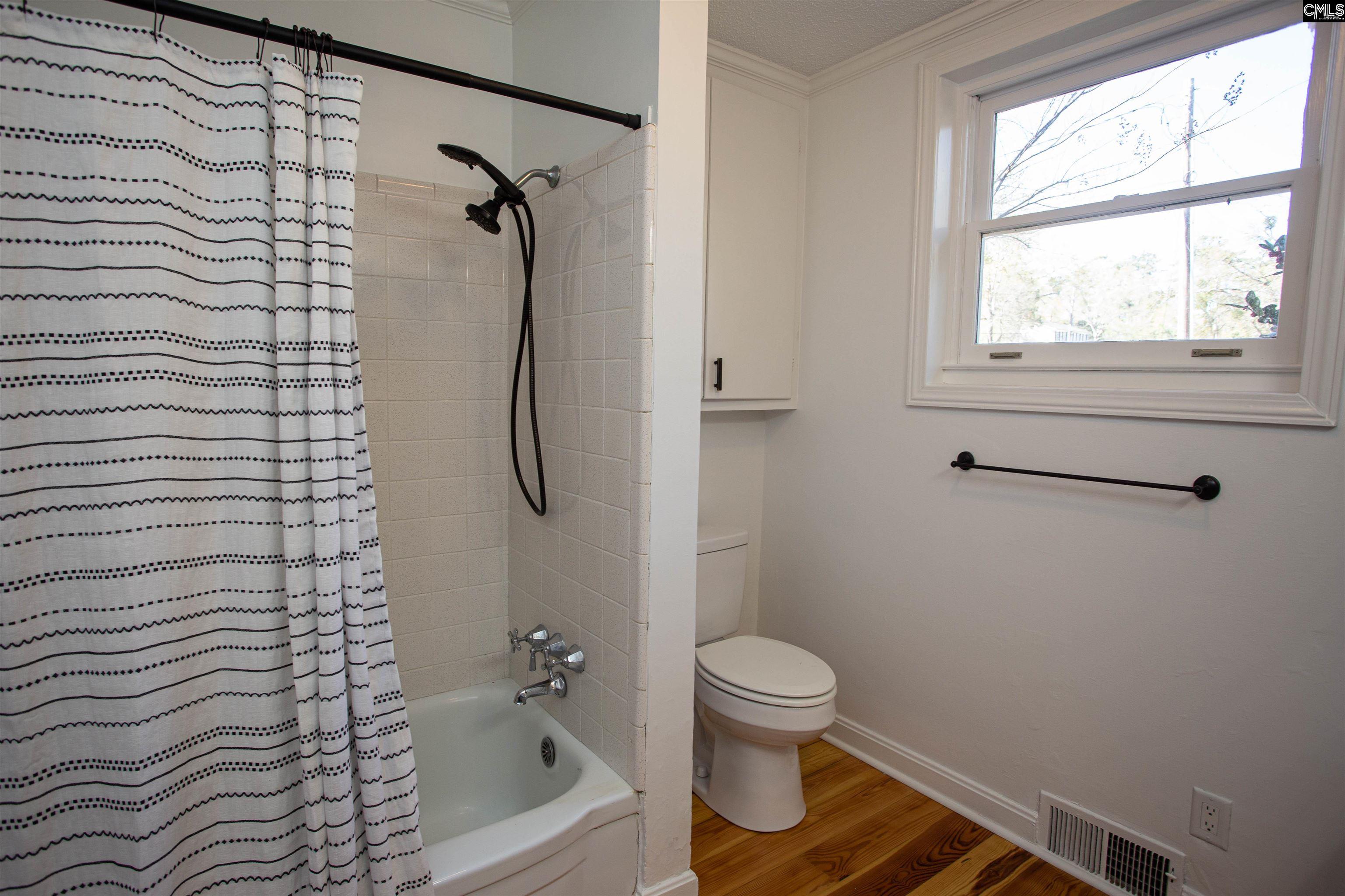 1700 Broad Street Camden, SC 29020 - Photo 18 of 41 a bathroom with a toilet and a shower