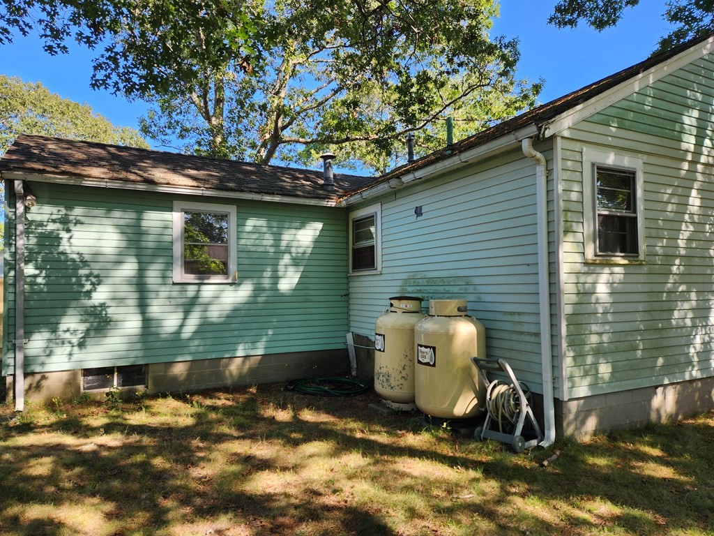 67 Ryder Street Buzzards Bay, MA 02532 - Photo 14 of 14 a view of a small house in the back yard