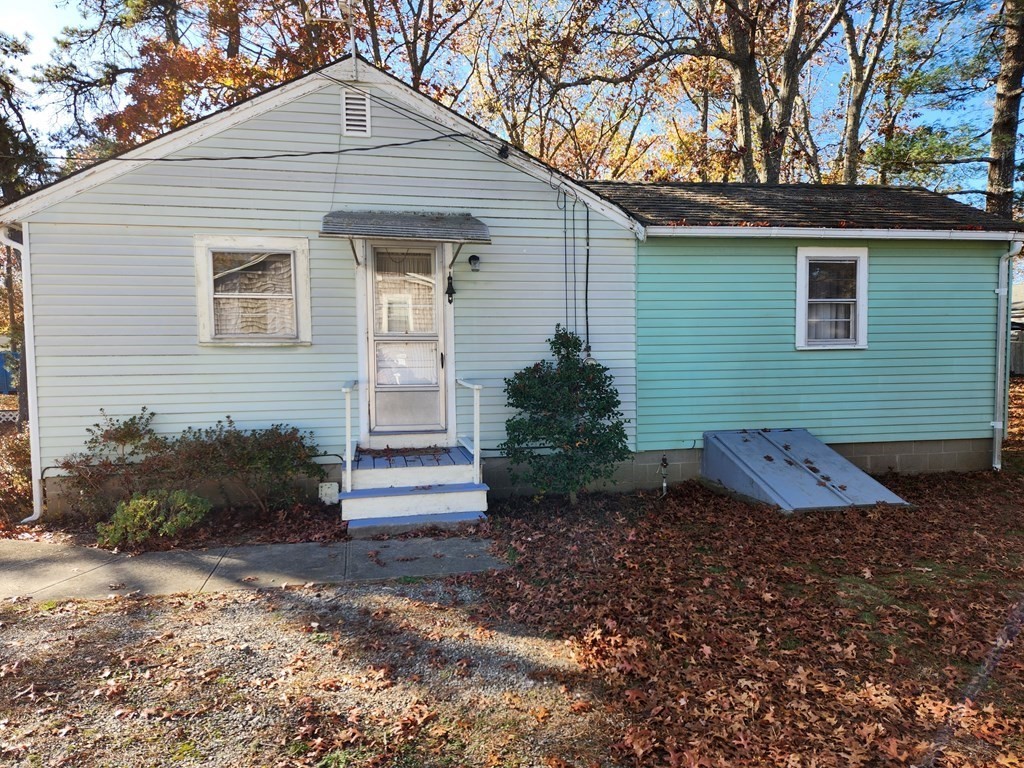 67 Ryder Street Buzzards Bay, MA 02532 - Photo 3 of 14 a front view of a house with a yard