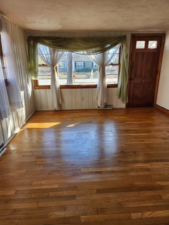 67 Ryder Street Buzzards Bay, MA 02532 - Photo 4 of 14 a view of empty room with wooden floor and fan