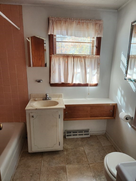 67 Ryder Street Buzzards Bay, MA 02532 - Photo 6 of 14 a bathroom with a sink toilet vanity and tub