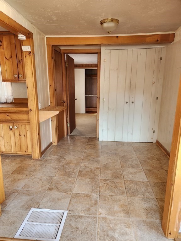 67 Ryder Street Buzzards Bay, MA 02532 - Photo 8 of 14 a view of a hallway with wooden shelves