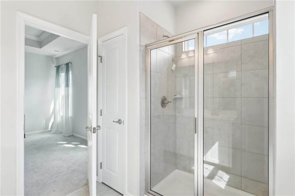 4300 Spruce Road Gibsonia, PA 15044 - Photo 31 of 48 a bathroom with a glass shower door