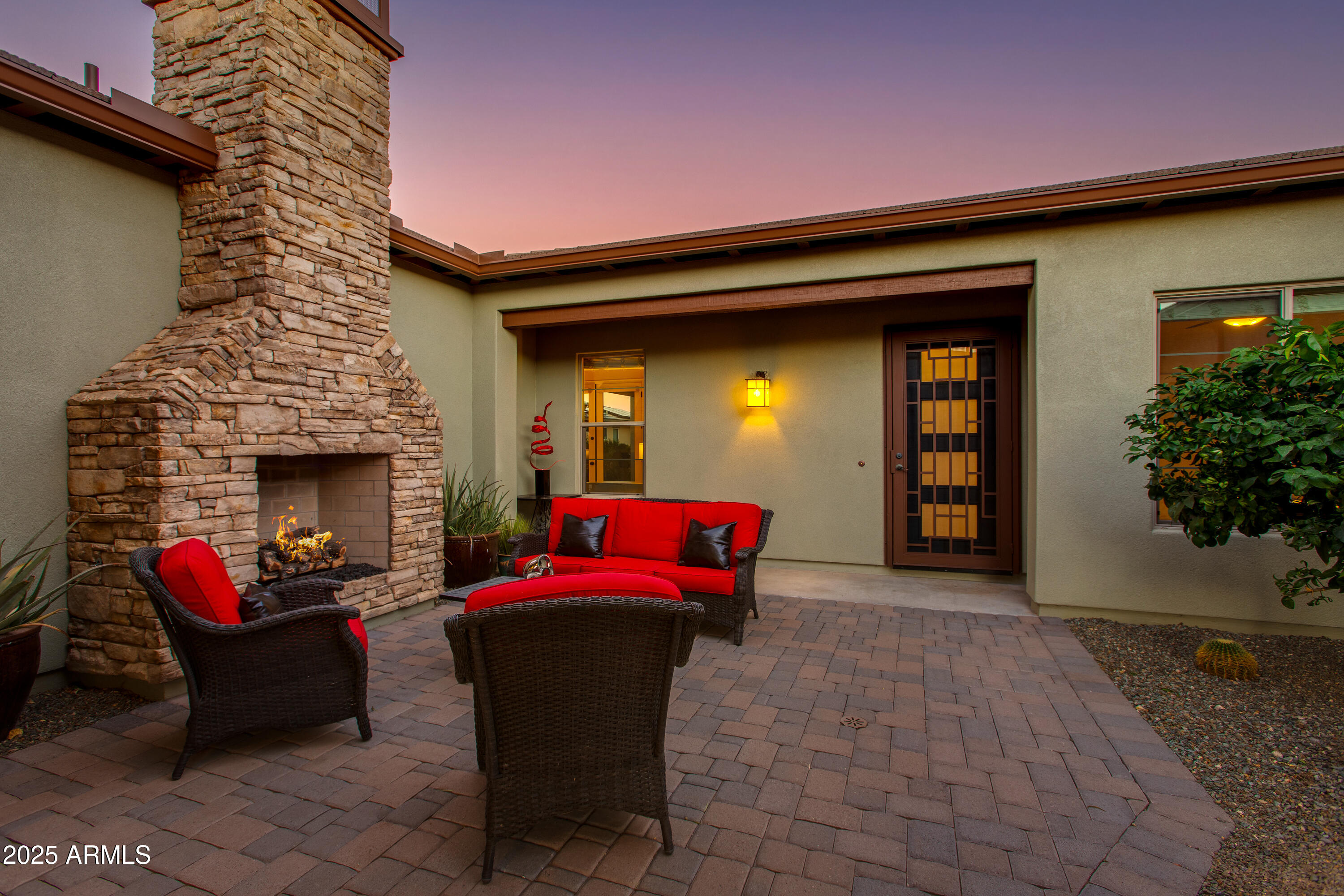 3675 Gold Ridge Road Wickenburg, AZ 85390 - Photo 16 of 66 a outdoor space with patio couch and a fireplace