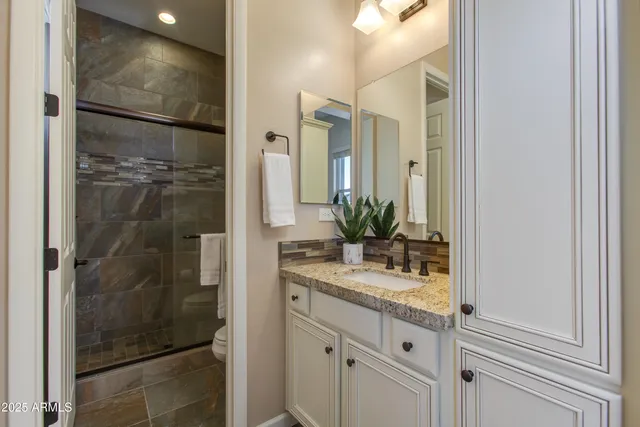 a kitchen with a stove and a wooden floors