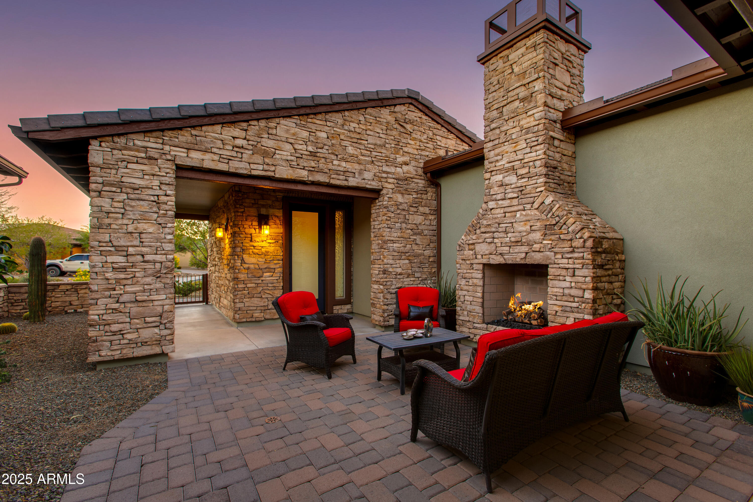 3675 Gold Ridge Road Wickenburg, AZ 85390 - Photo 2 of 66 a view of a patio with table and chairs and potted plants