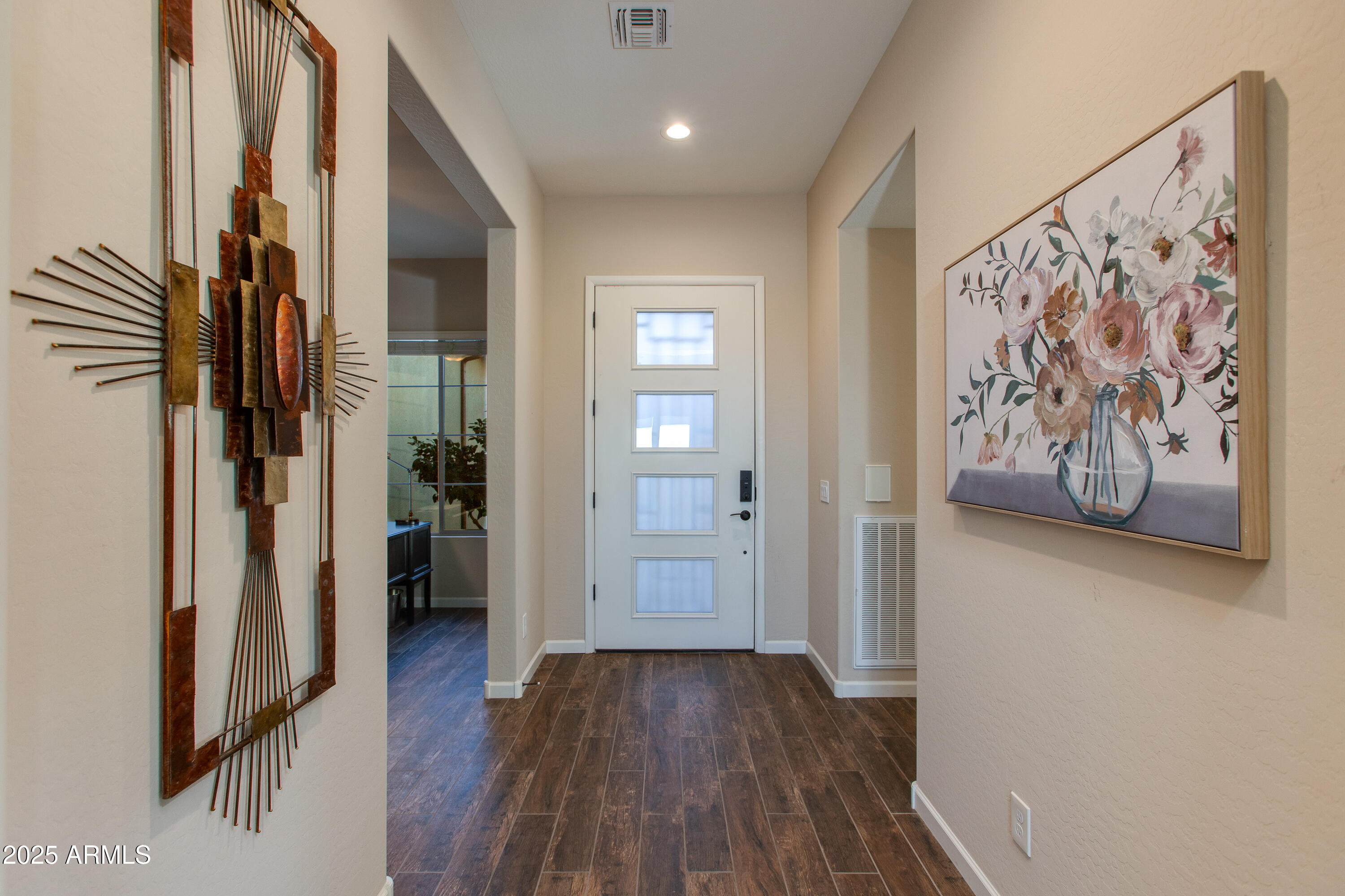 3675 Gold Ridge Road Wickenburg, AZ 85390 - Photo 22 of 66 a view of a hallway with wooden floor and closet