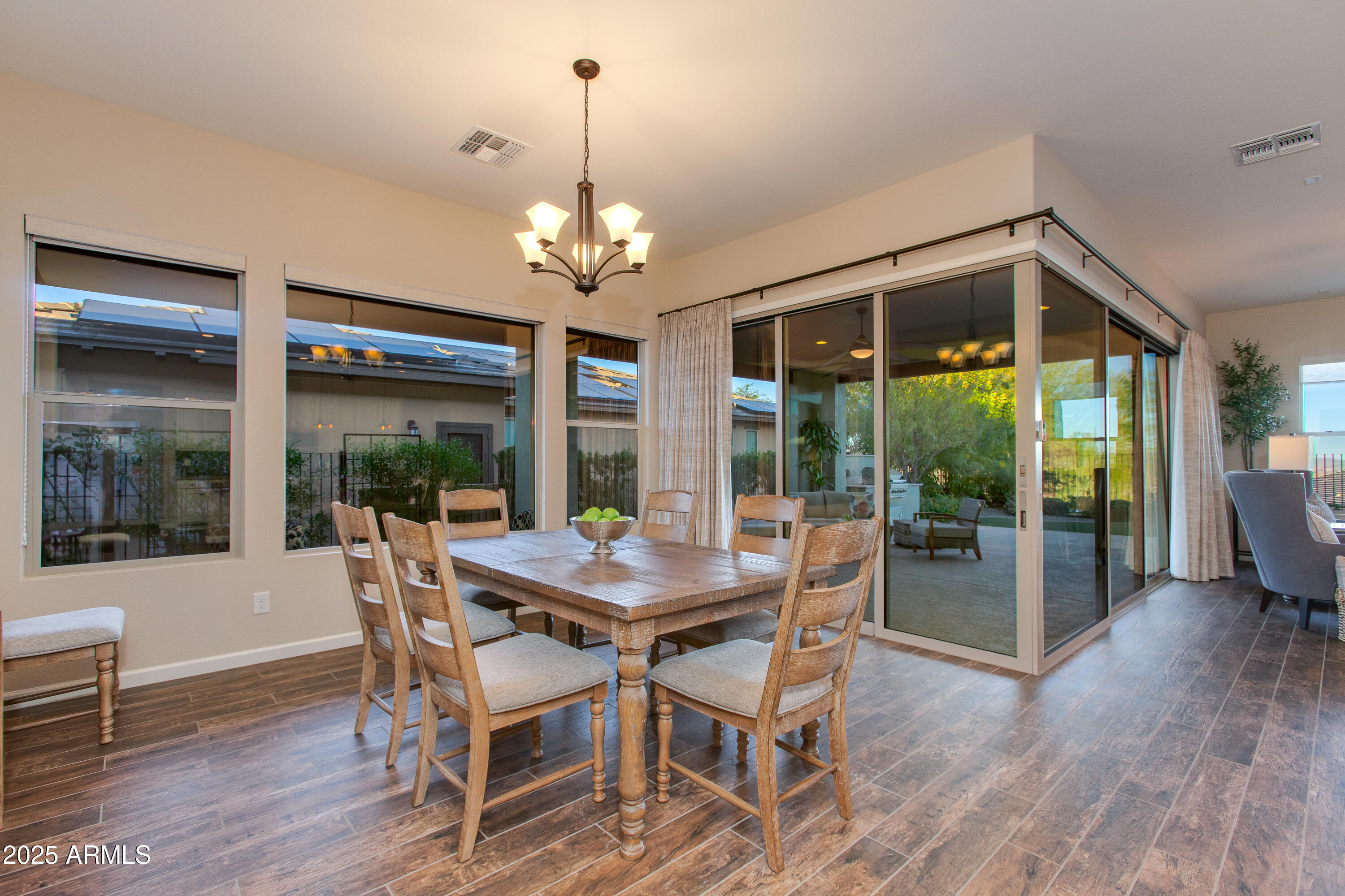 3675 Gold Ridge Road Wickenburg, AZ 85390 - Photo 24 of 66 a view of a dining room with furniture wooden floor and chandelier