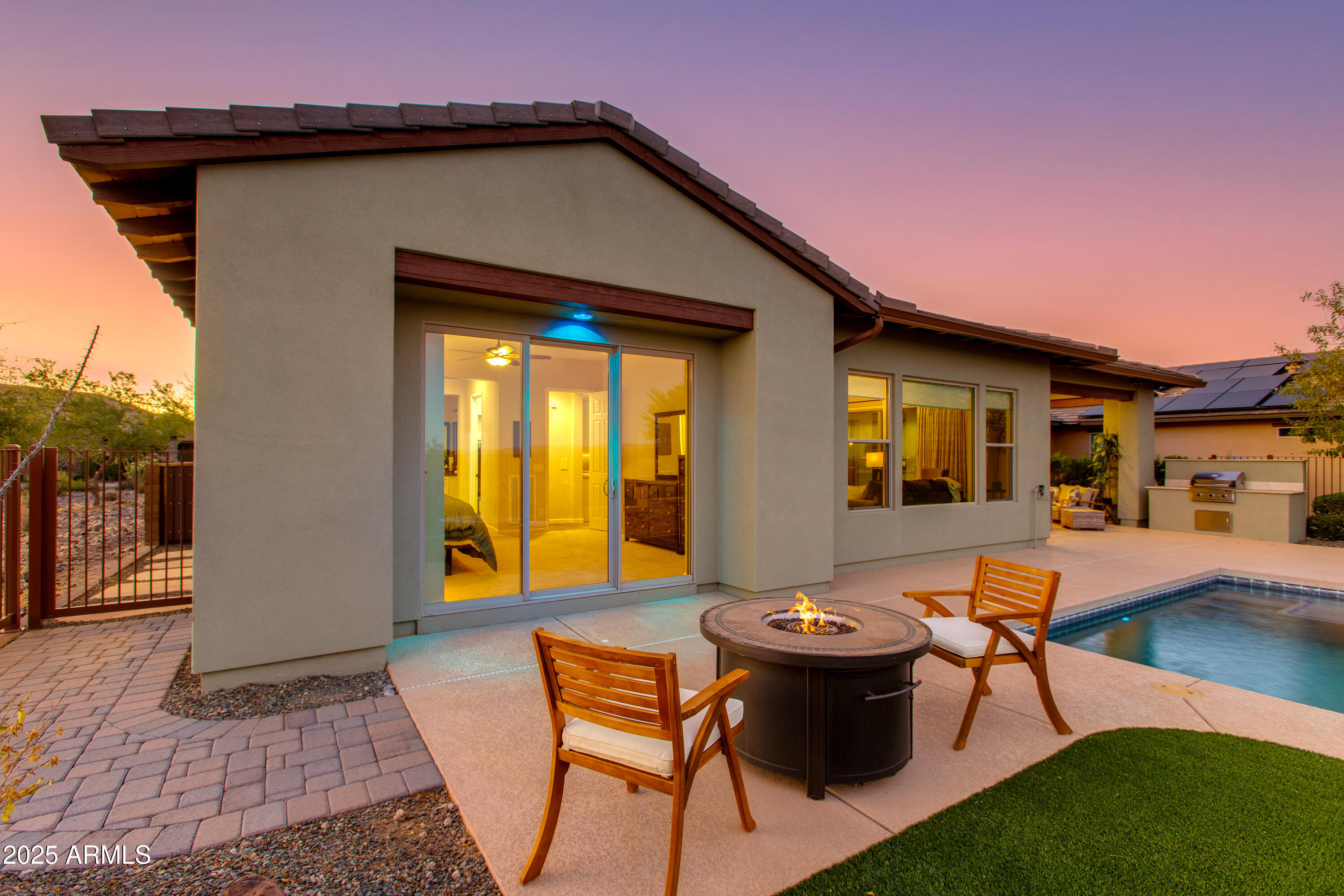 3675 Gold Ridge Road Wickenburg, AZ 85390 - Photo 47 of 66 a view of a patio with table and chairs with wooden floor and fence