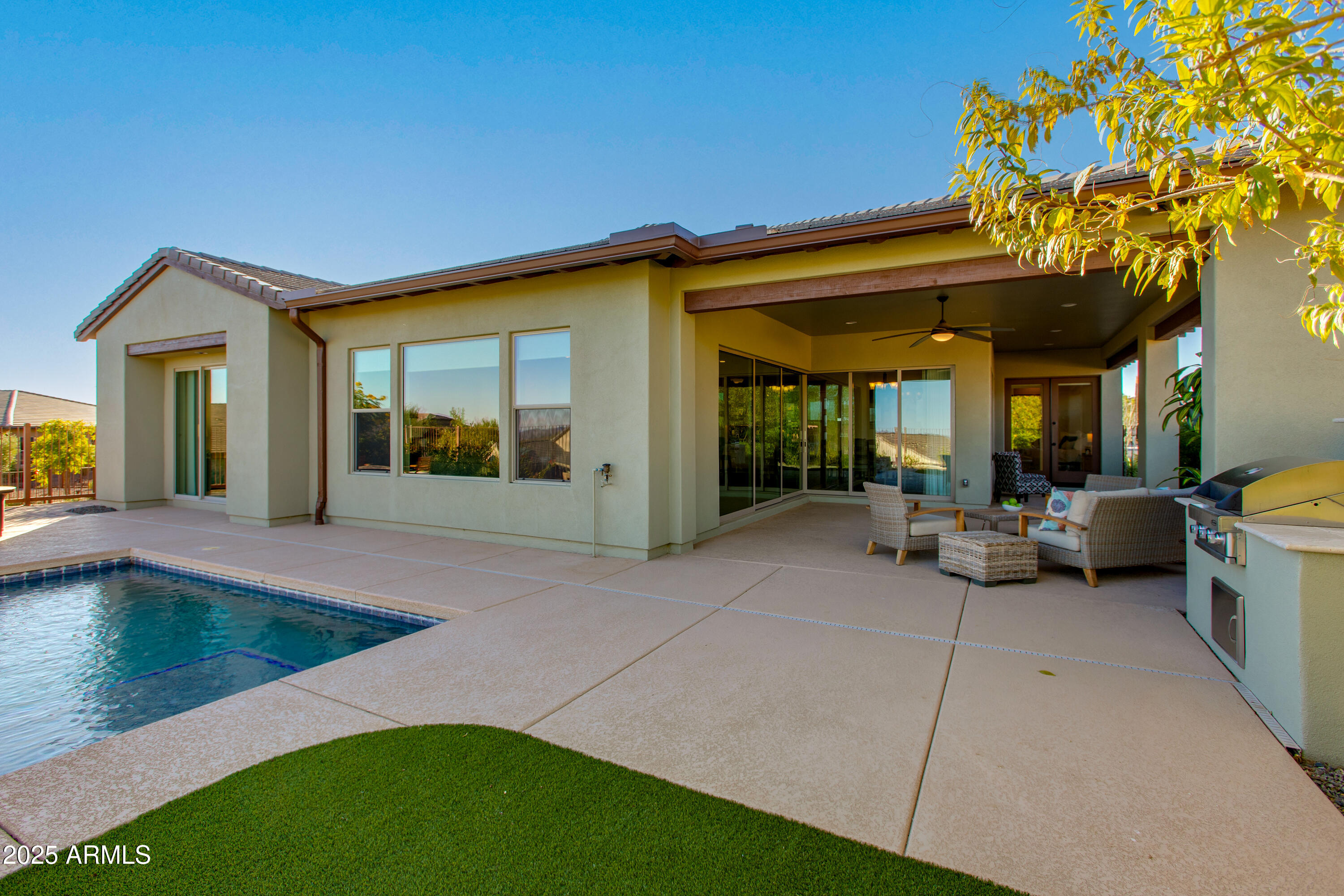 3675 Gold Ridge Road Wickenburg, AZ 85390 - Photo 57 of 66 a view of a patio with couches table and chairs and potted plants