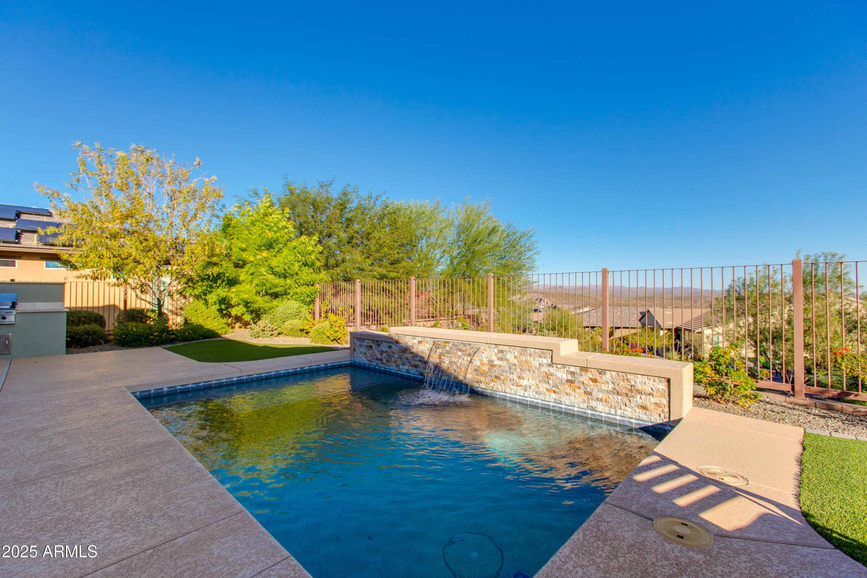 3675 Gold Ridge Road Wickenburg, AZ 85390 - Photo 59 of 66 a view of a swimming pool with an outdoor space and seating area