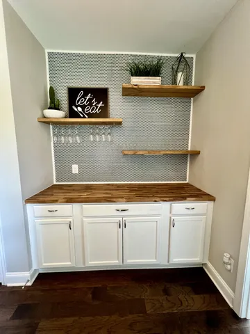 a view of cabinets with wooden floor