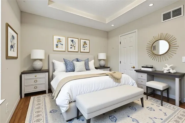 a bedroom with a bed and a dresser