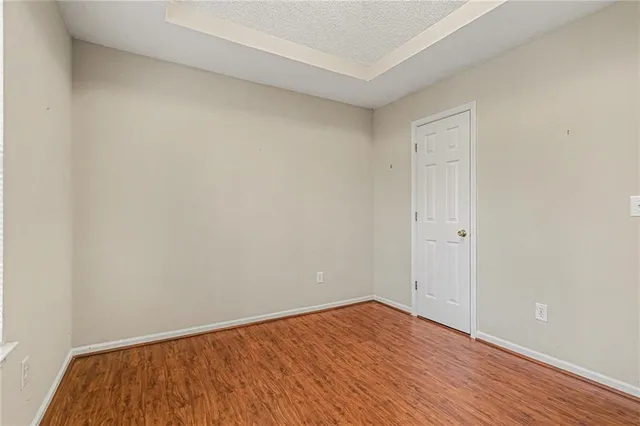 an empty room with wooden floor