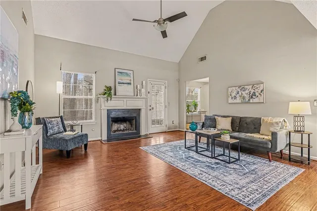 a living room with furniture and a fireplace
