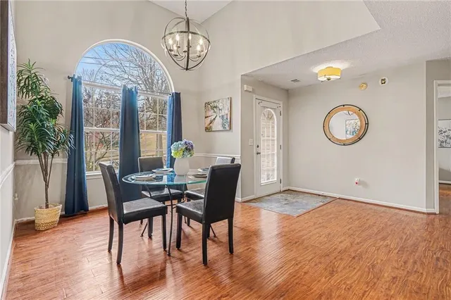 a view of a dining room with furniture window and wooden floor