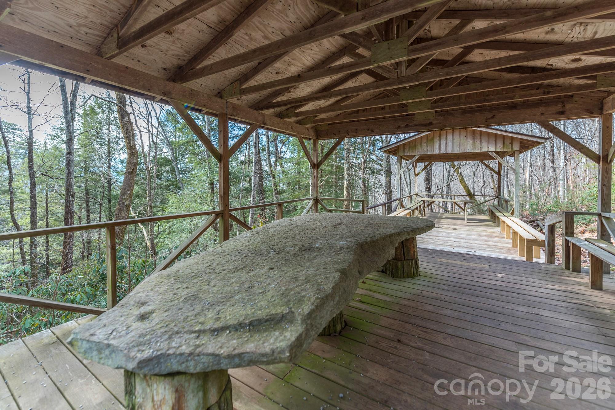 100 Wolf Pen Road Old Fort, NC 28762 - Photo 38 of 43 a view of a roof deck with wooden floor and outdoor seating