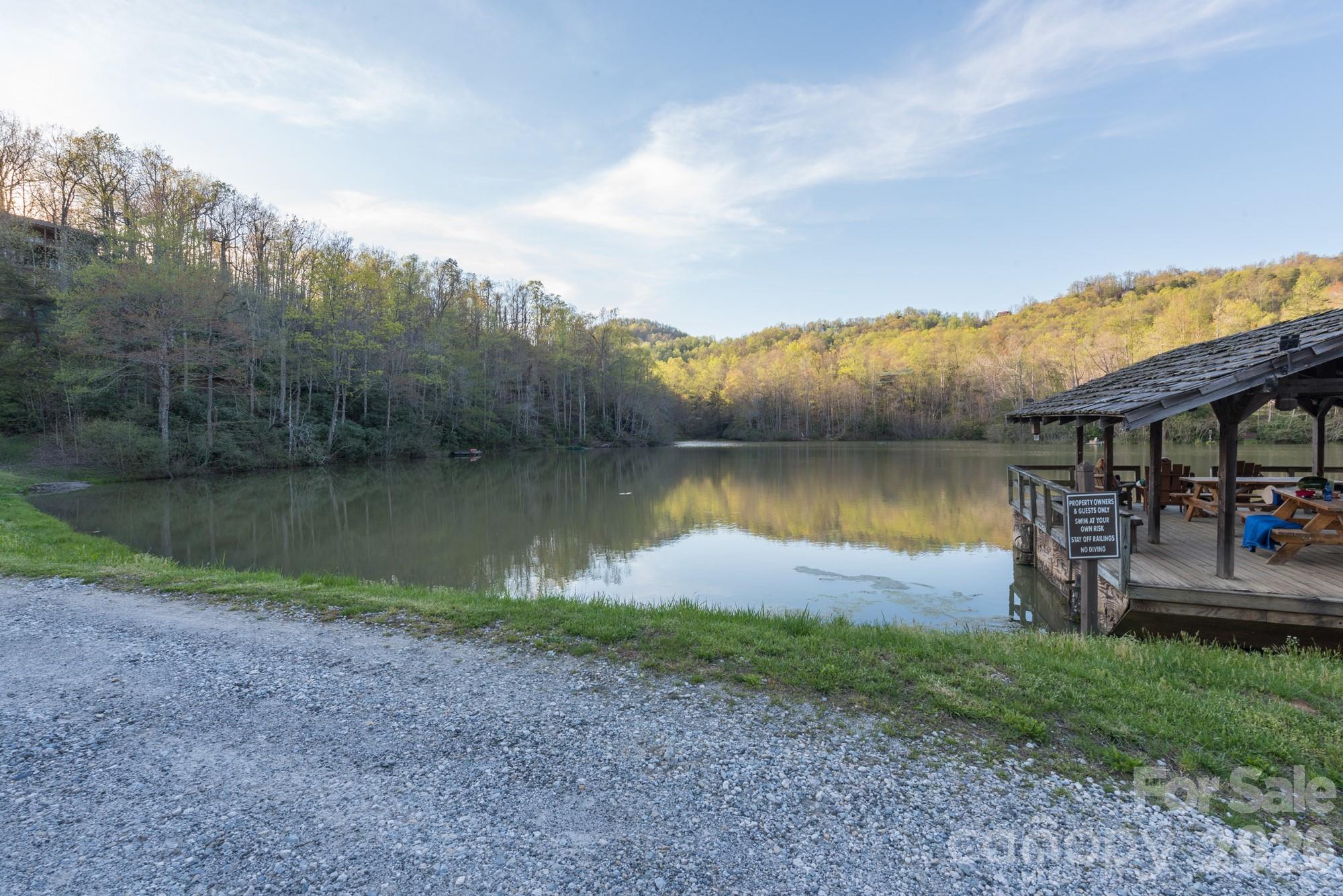 100 Wolf Pen Road Old Fort, NC 28762 - Photo 40 of 43 a view of a lake with houses in back