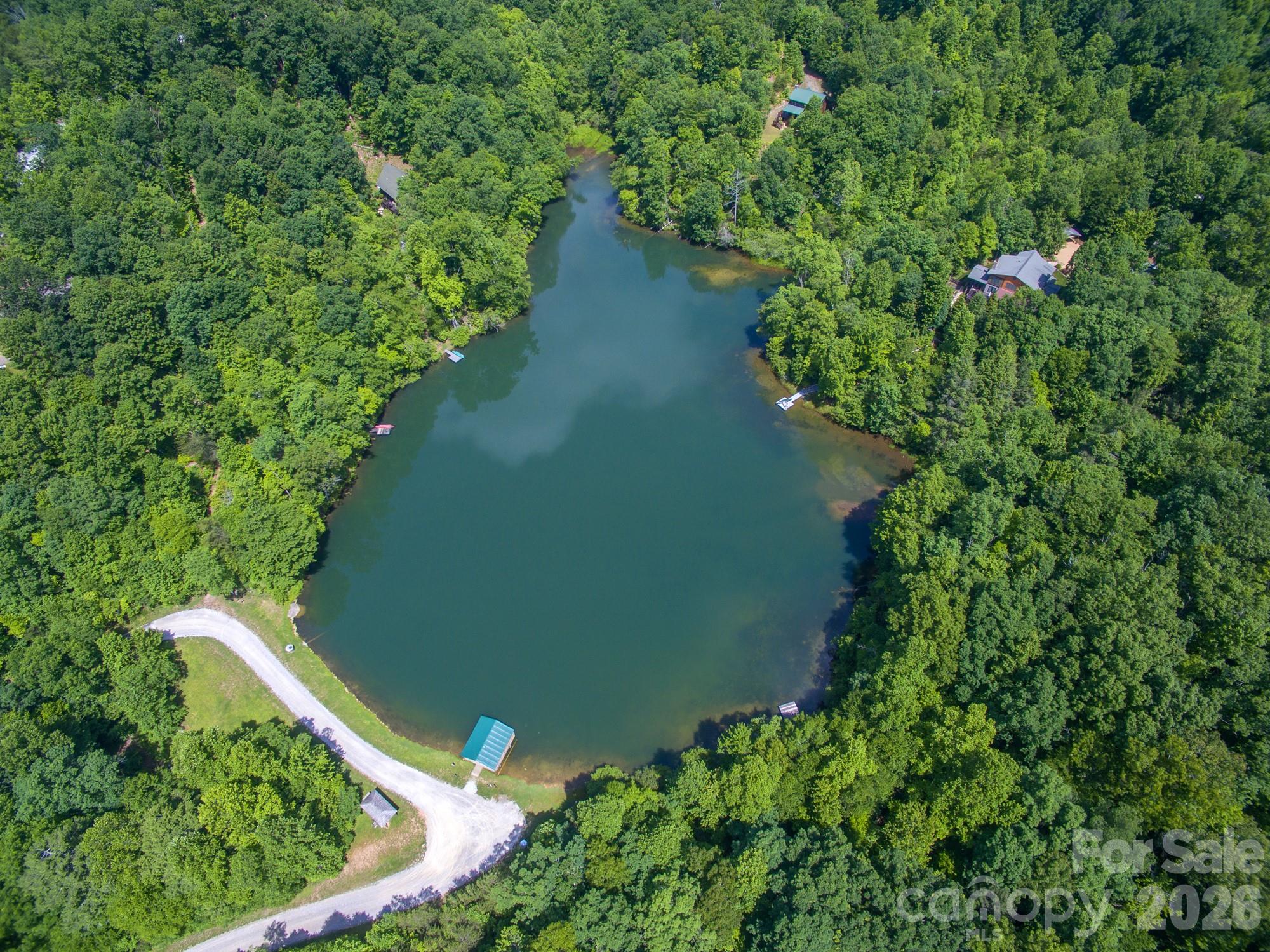 100 Wolf Pen Road Old Fort, NC 28762 - Photo 41 of 43 an aerial view of residential house with outdoor space and trees all around