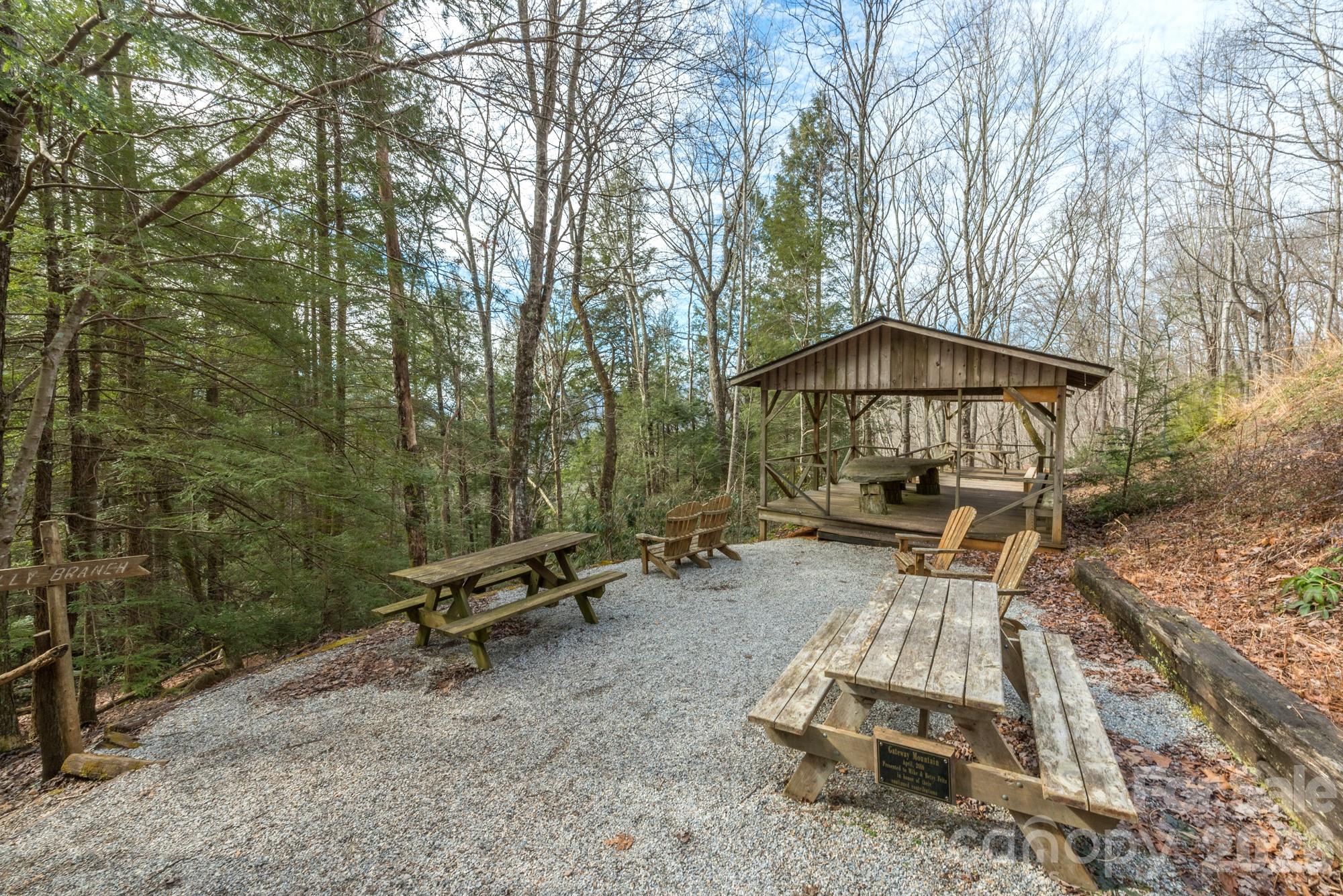 100 Wolf Pen Road Old Fort, NC 28762 - Photo 42 of 43 an outdoor sitting area with umbrella and trees