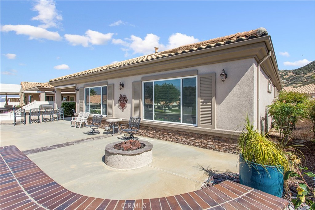 5233 Hampton Road Banning, CA 92220 - Photo 29 of 46 a view of a house with swimming pool and sitting area