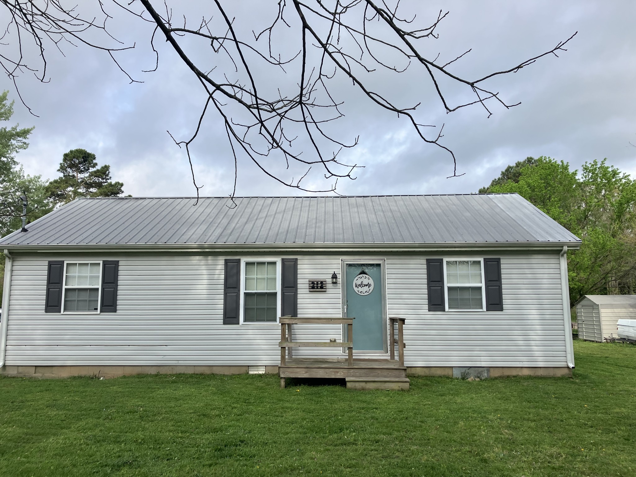 212 Cherry Street Ethridge, TN 38456 - Photo 12 of 12 a front view of a house with a yard