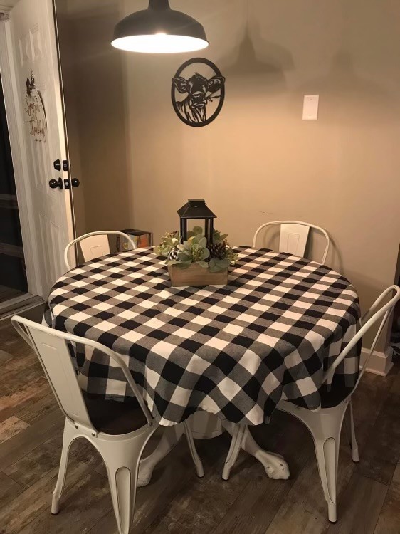 212 Cherry Street Ethridge, TN 38456 - Photo 3 of 12 a bedroom with a bed and a chandelier