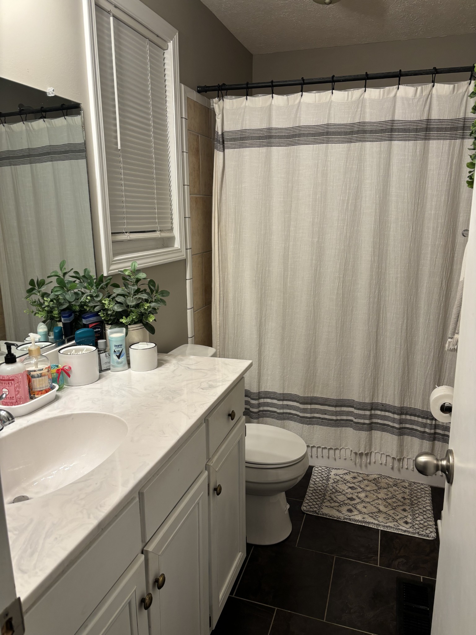 212 Cherry Street Ethridge, TN 38456 - Photo 9 of 12 a bathroom with a granite countertop sink and a mirror