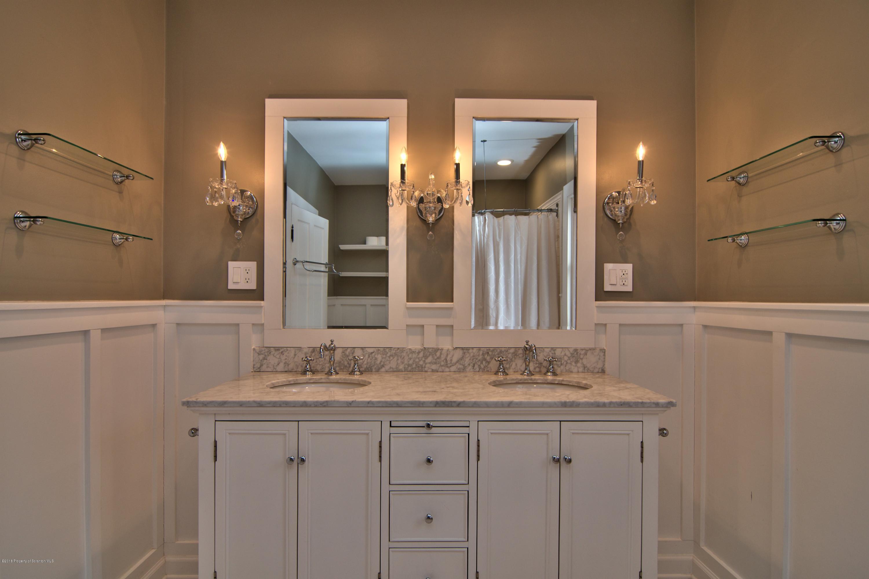 754 Green Ridge Street Scranton, PA 18509 - Photo 12 of 77 a bathroom with double sink and a mirror