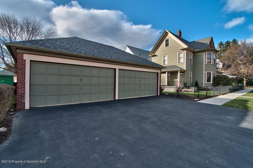 754 Green Ridge Street Scranton, PA 18509 - Photo 24 of 77 a front view of a house with a garage